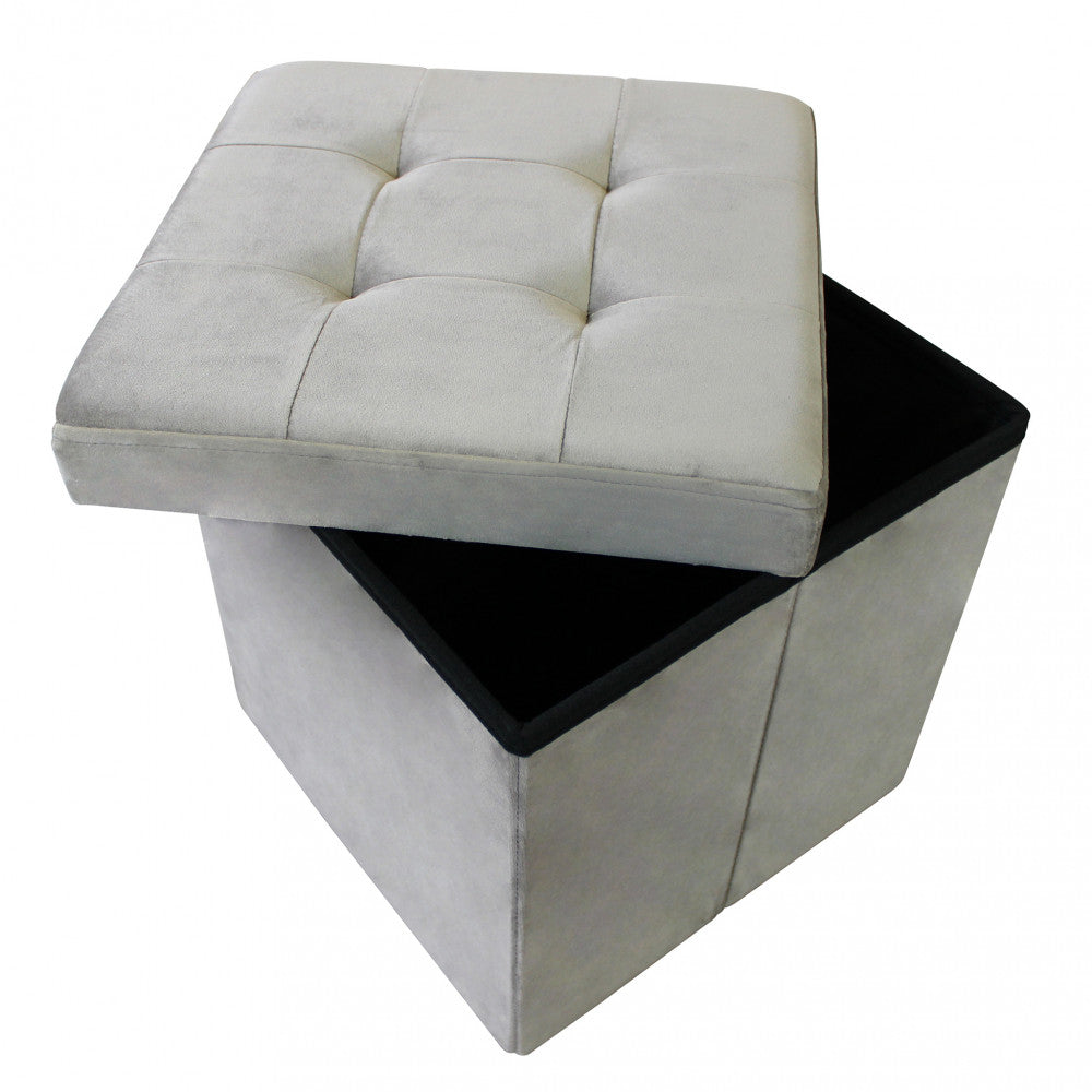 Vista dall'alto del pouf contenitore con coperchio spostato per rivelare lo spazio interno.