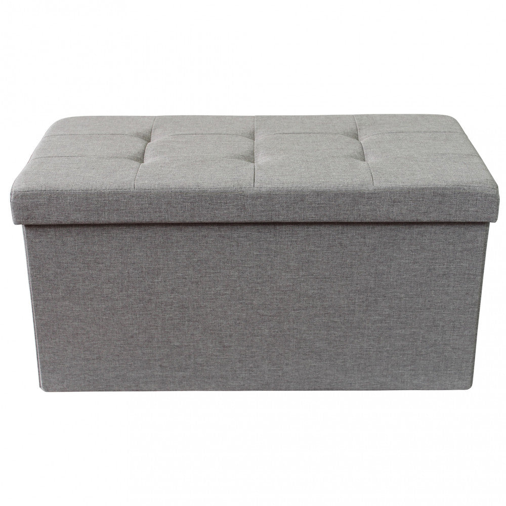 Vista frontale del pouf contenitore in tessuto grigio, mostrando le linee pulite e la struttura solida.