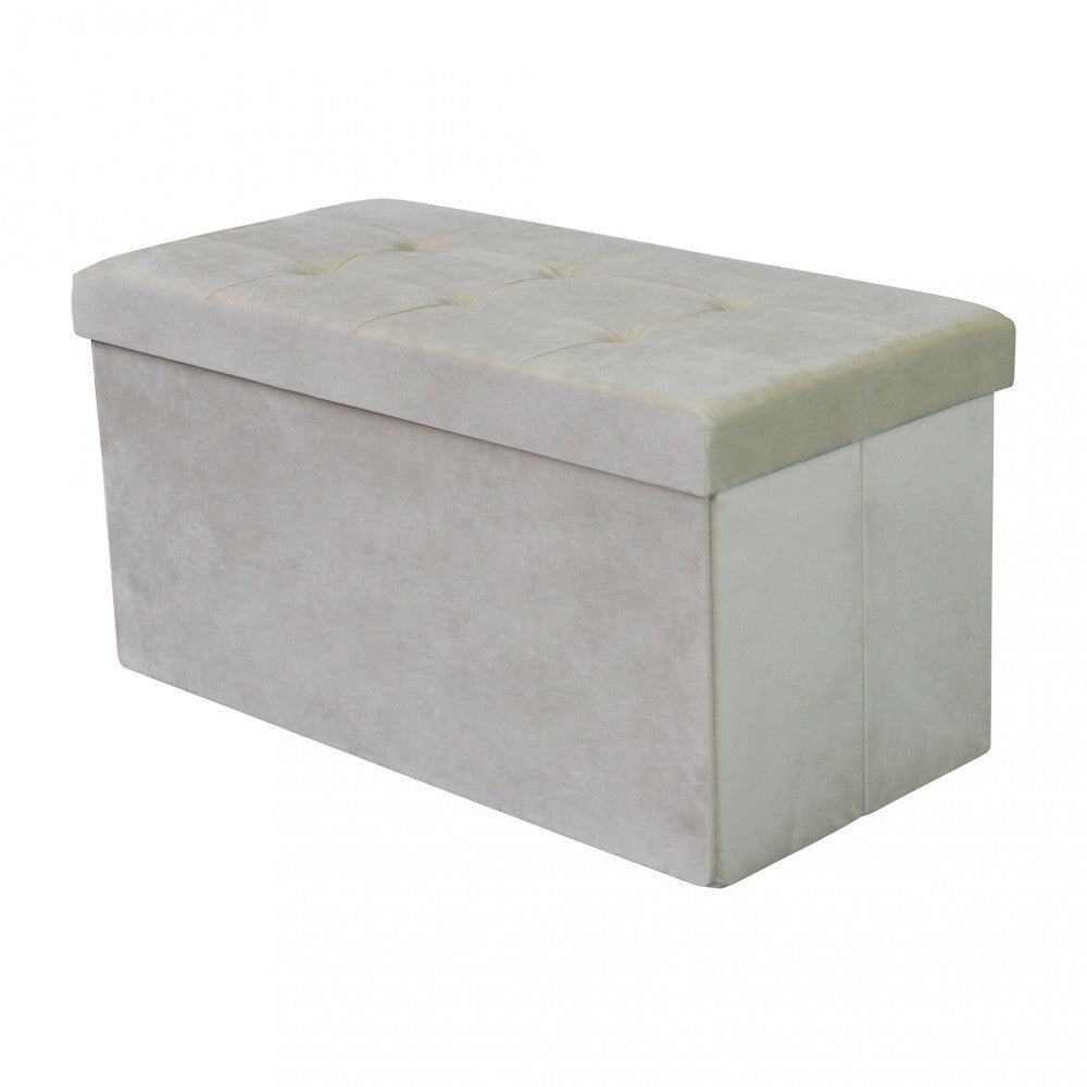 Vista angolare del pouf contenitore chiuso in velluto beige su sfondo neutro.