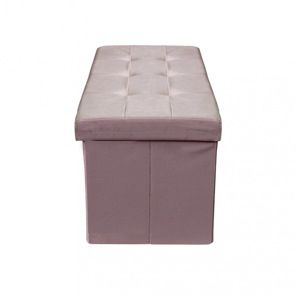 Vista laterale del pouf contenitore rettangolare in velluto rosa, mostrando il profilo compatto e le finiture sartoriali.