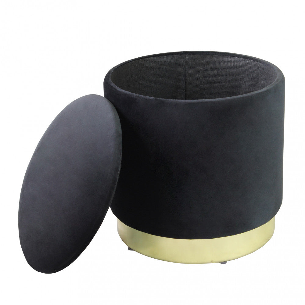 Pouf contenitore in velluto nero aperto, mostrando lo spazio interno foderato e il coperchio imbottito.
