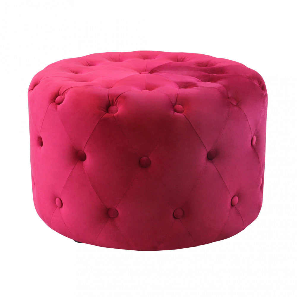 Vista frontale del pouf rotondo in velluto bordeaux su sfondo neutro, che evidenzia la lavorazione a bottoni.