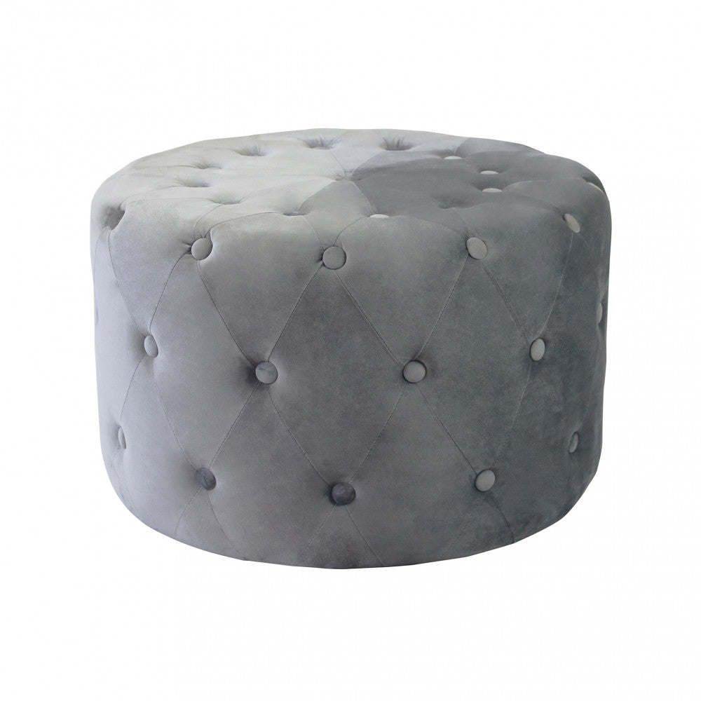 Vista frontale del pouf rotondo in velluto grigio scuro su sfondo bianco.