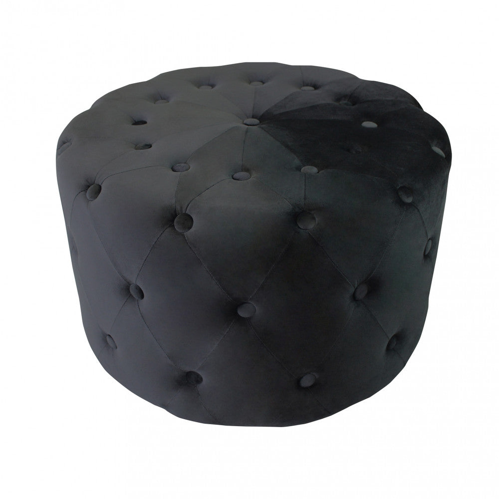Vista dall'alto del pouf rotondo in velluto nero, mostrando la simmetria del design e la texture del tessuto.