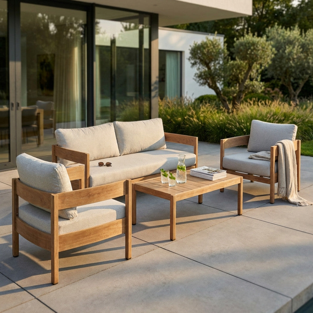 Salotto Bridgetown completo a quattro posti in alluminio marrone chiaro e cuscini in olefin grigio chiaro, ambientato su un patio moderno.