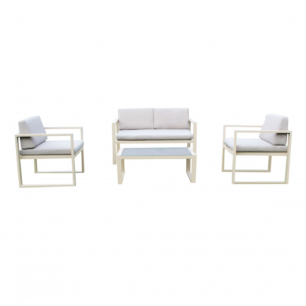 Salotto Formentera completo con struttura in alluminio bianco, cuscini in poliestere e tavolino in vetro.