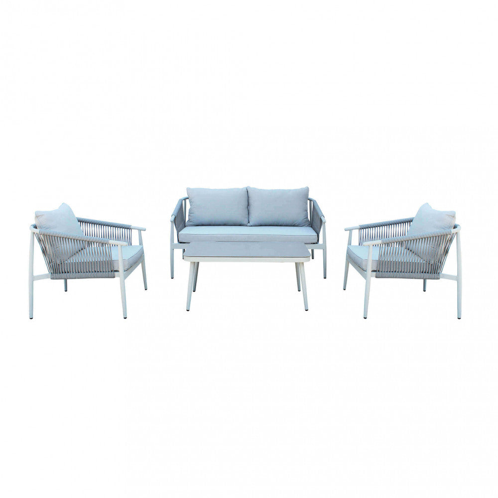 Composizione frontale simmetrica del set Mumbai con divano, due poltrone e tavolino.