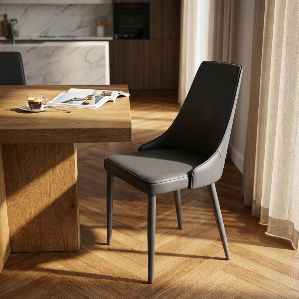 Sedia Camille ambientata in una sala da pranzo moderna con tavolo in legno e luce naturale.