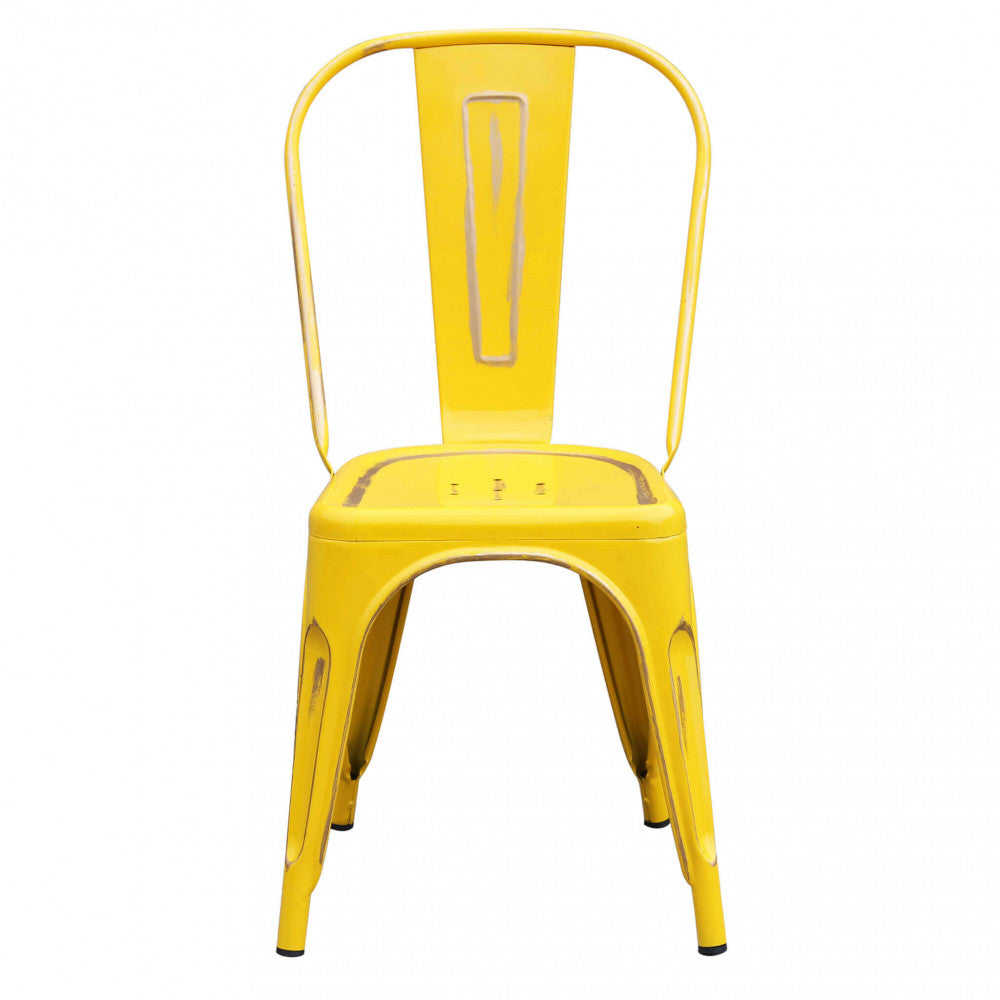 Vista frontale della sedia senza braccioli Lola in acciaio giallo anticato su sfondo bianco.
