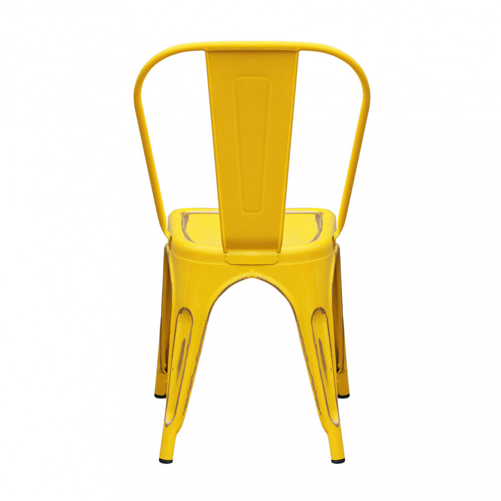 Vista posteriore della sedia Lola in metallo giallo, mostrando lo schienale ergonomico e le gambe svasate.