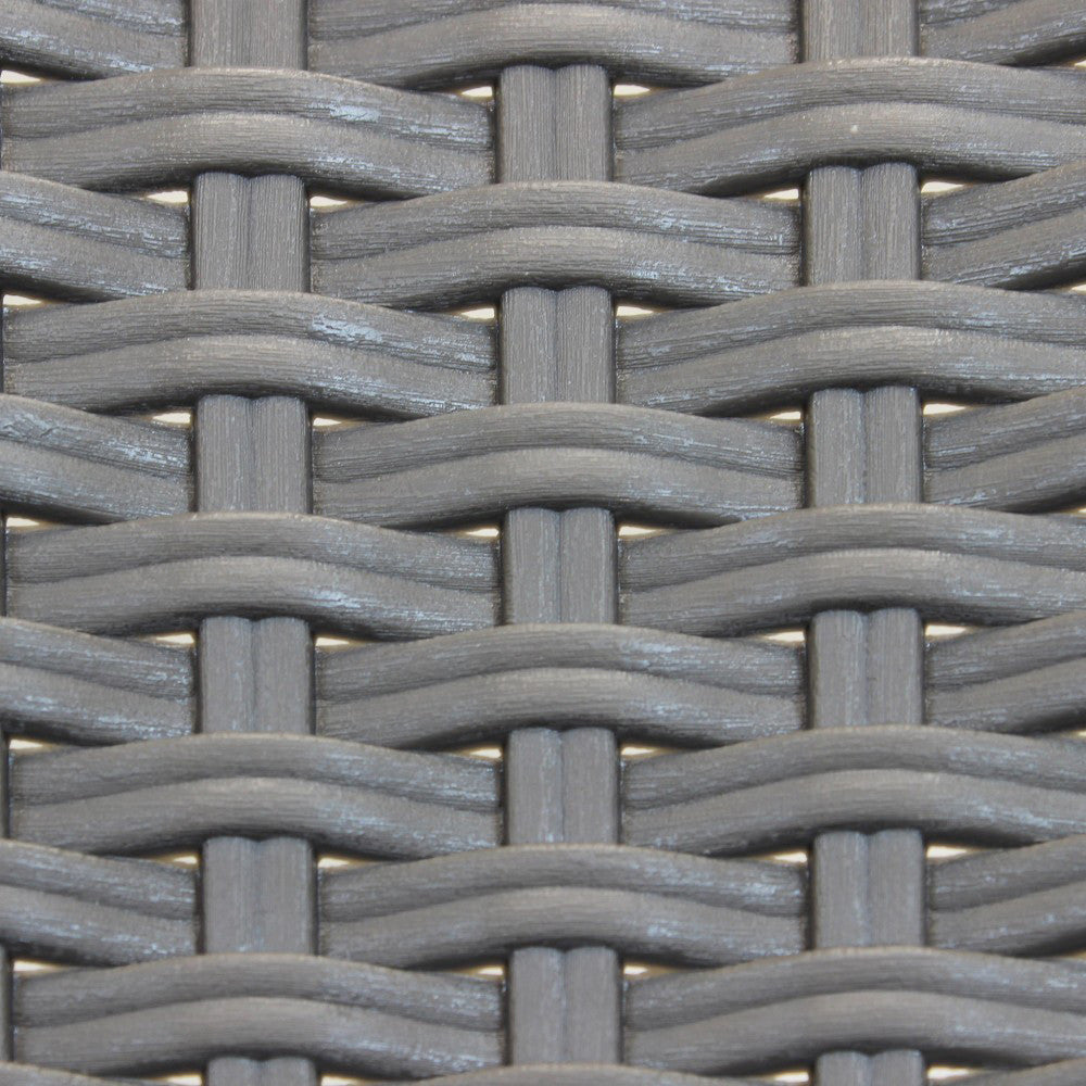 Dettaglio macro dell'intreccio in wicker tortora, che mostra la maestria artigianale e la texture materica.