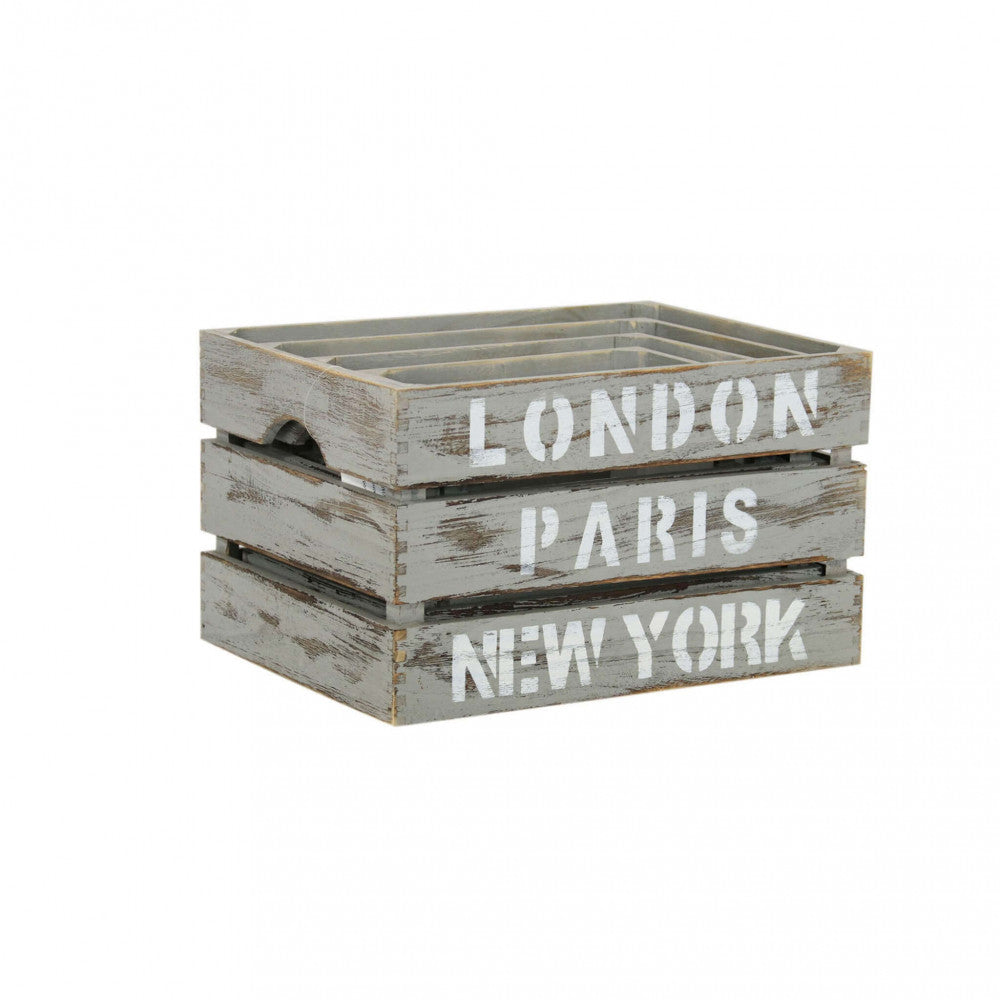 Le quattro cassette in legno grigio Nicole impilate una dentro l'altra, mostrando le scritte bianche London, Paris, New York.