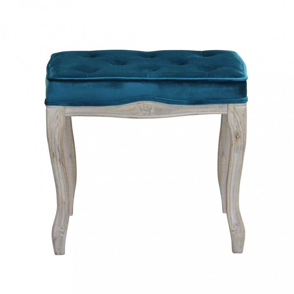 Vista frontale dello sgabello Marly in velluto blu con gambe sinuose in legno.