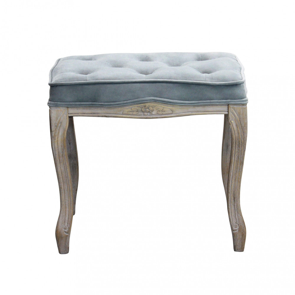 Sgabello Marly in legno e velluto grigio, vista laterale che evidenzia le gambe intagliate.