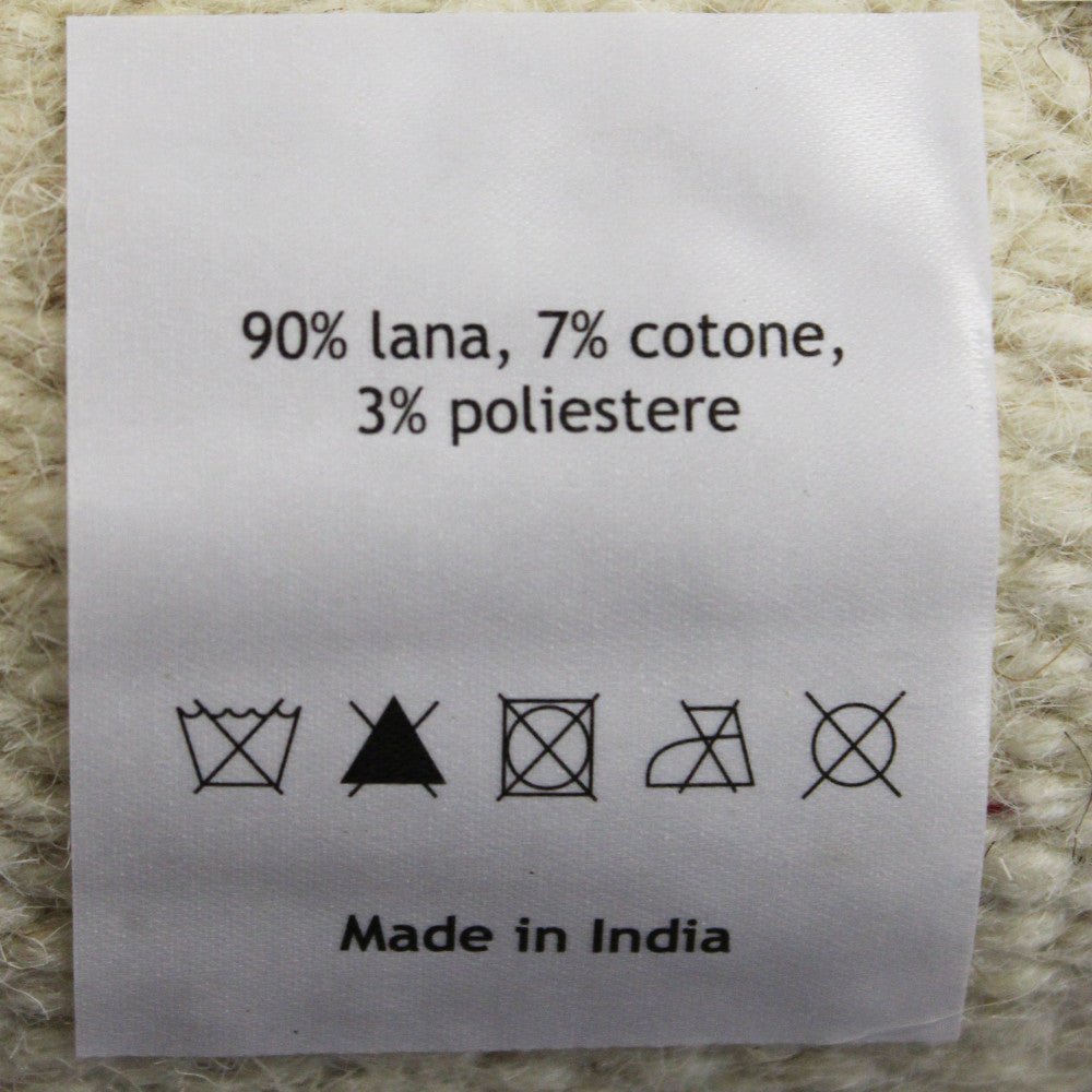 Etichetta del Tappeto Antoine con composizione 90% lana, 7% cotone, 3% poliestere e indicazione Made in India.