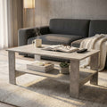 Tavolino da salotto Match effetto cemento ambientato in un living moderno con divano grigio e tazza fumante.