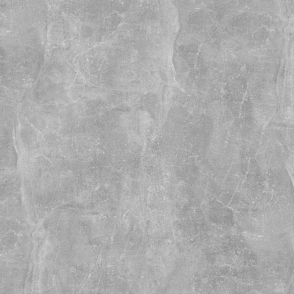 Texture ravvicinata del truciolare bilaminato con finitura effetto cemento grigio, evidenziando i dettagli materici.