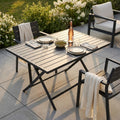 Tavolo da giardino Alabama in alluminio allestito per un aperitivo al tramonto su un patio moderno.