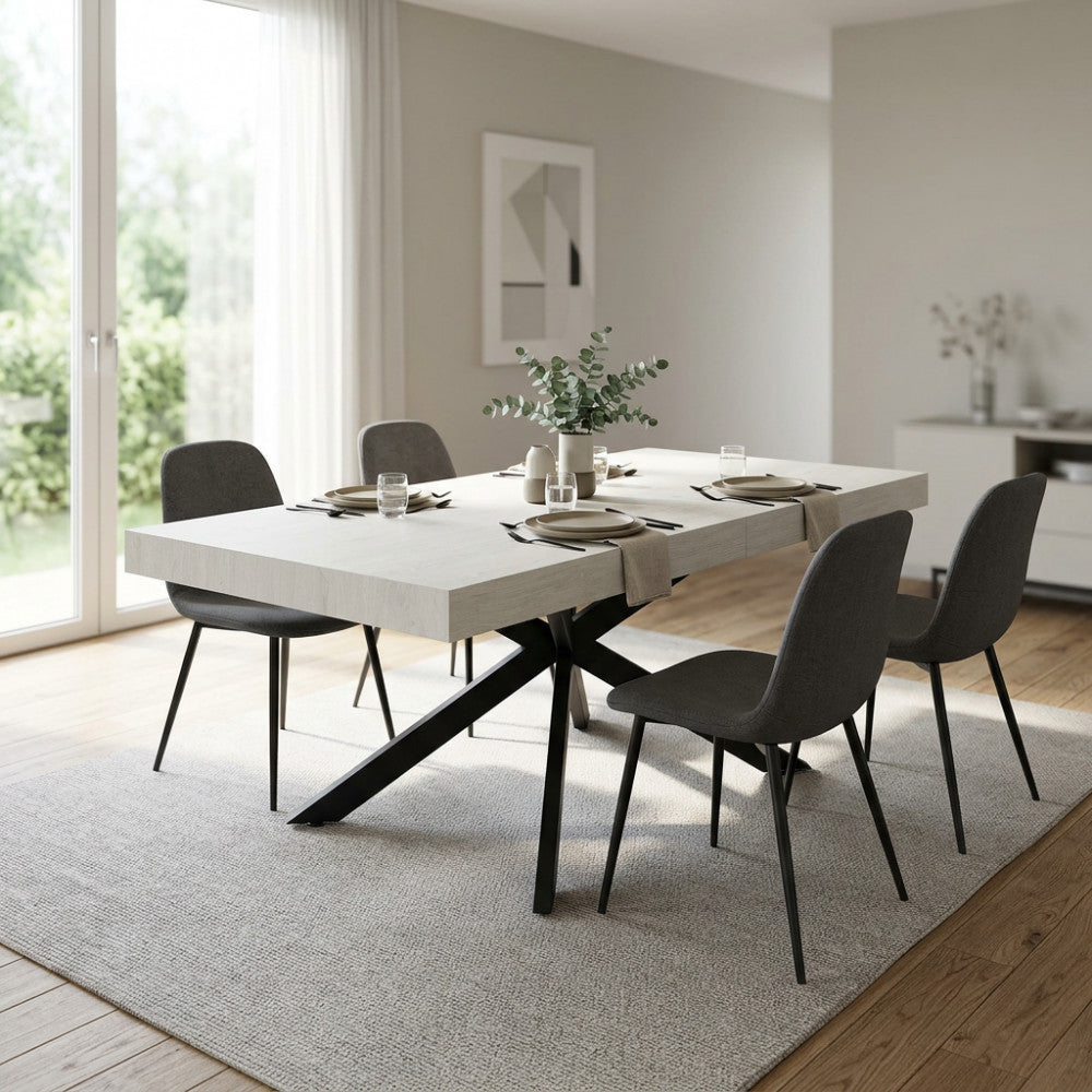 Tavolo da pranzo allungabile Darren in melaminico bianco effetto legno ambientato in una sala luminosa.