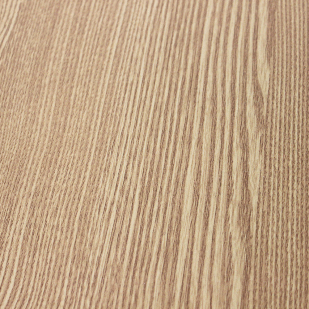 Primo piano della texture tattile e delle venature naturali del piano in legno del tavolo Archibald.