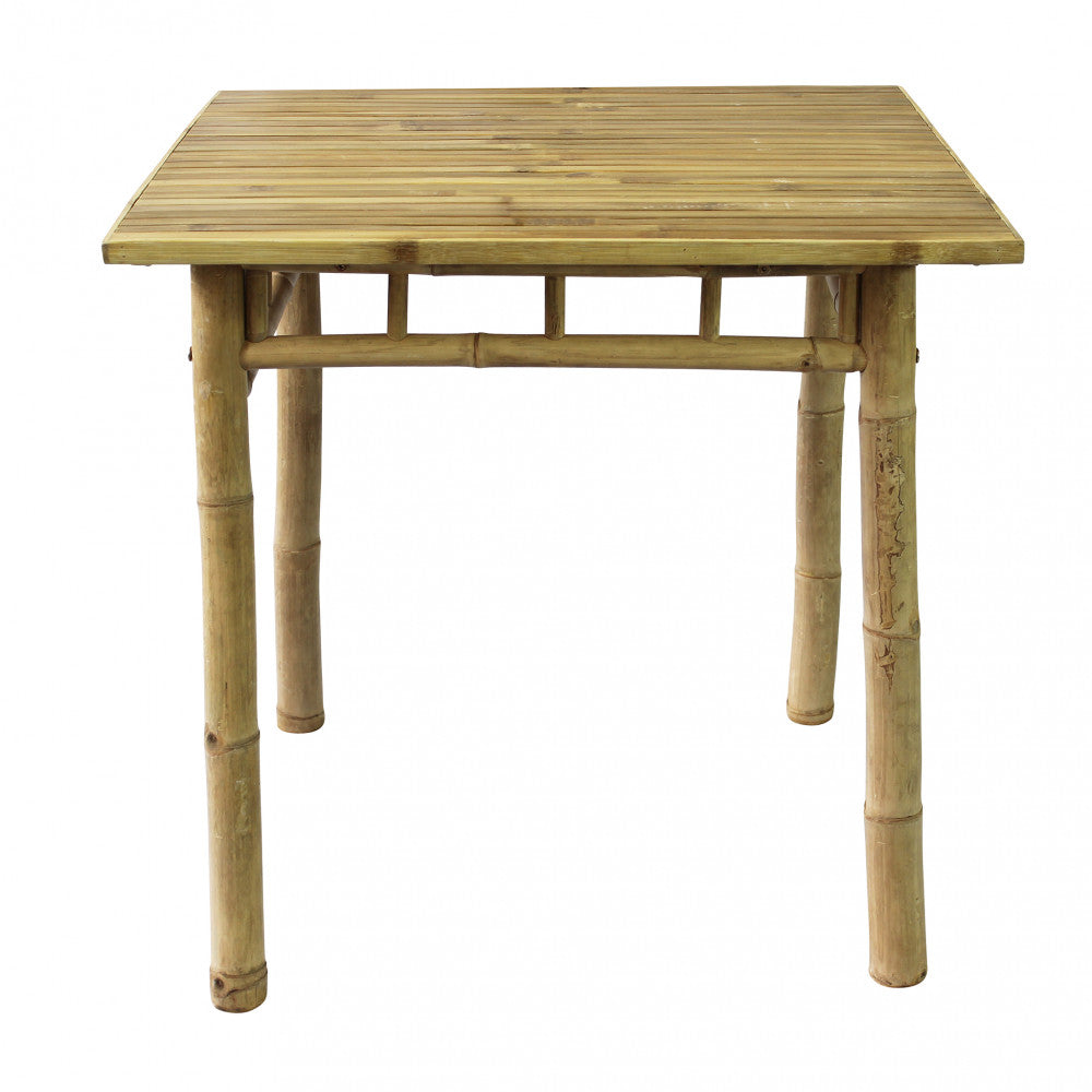 Tavolo Aviation 80 in bamboo su un terrazzo arredato con mobili da esterno.