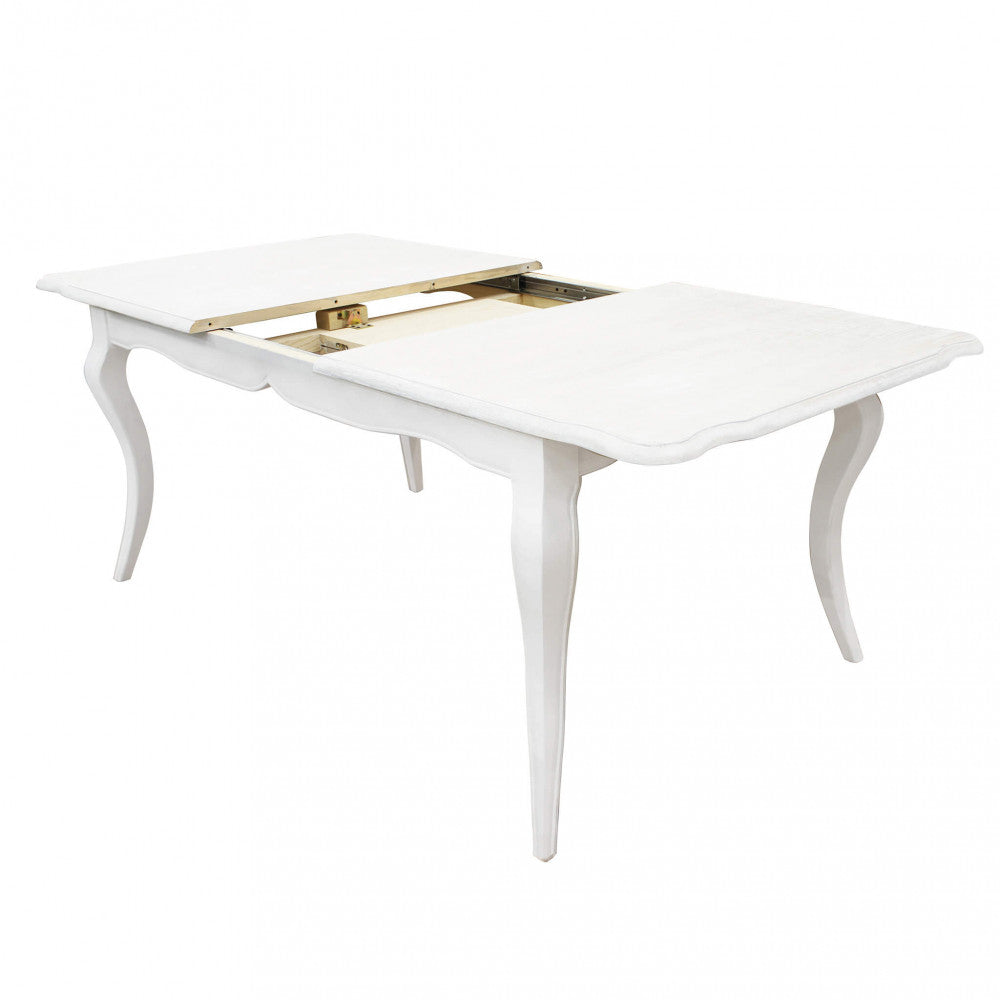 Tavolo da pranzo con piano separato e guide metalliche a vista per l'inserimento dell'allunga.