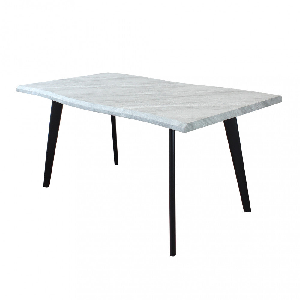 Vista frontale del tavolo fisso Dalbert con piano effetto pietra e gambe nere a contrasto su sfondo bianco.