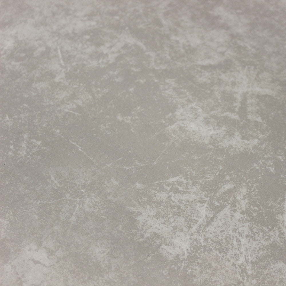 Texture materica del piano in pietra sinterizzata del tavolo Freeport, con sfumature grigie e venature delicate che simulano la pietra naturale.