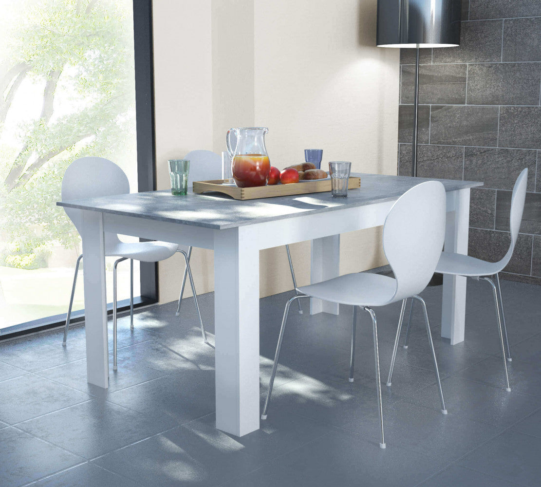 Dettaglio del tavolo Gemma in un contesto moderno con sedie bianche di design e luce naturale.