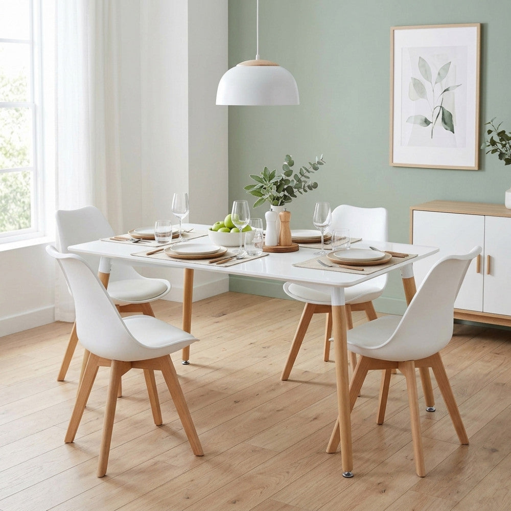 Tavolo da pranzo Lione bianco 140x80 cm allestito in una sala da pranzo moderna con sedie coordinate.