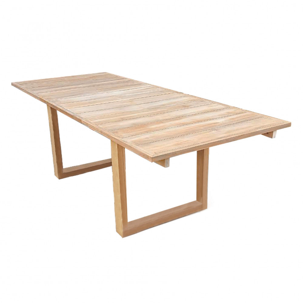 Dettaglio strutturale del tavolo da giardino in teak Parker, che mostra il piano a doghe e le solide gambe a U.
