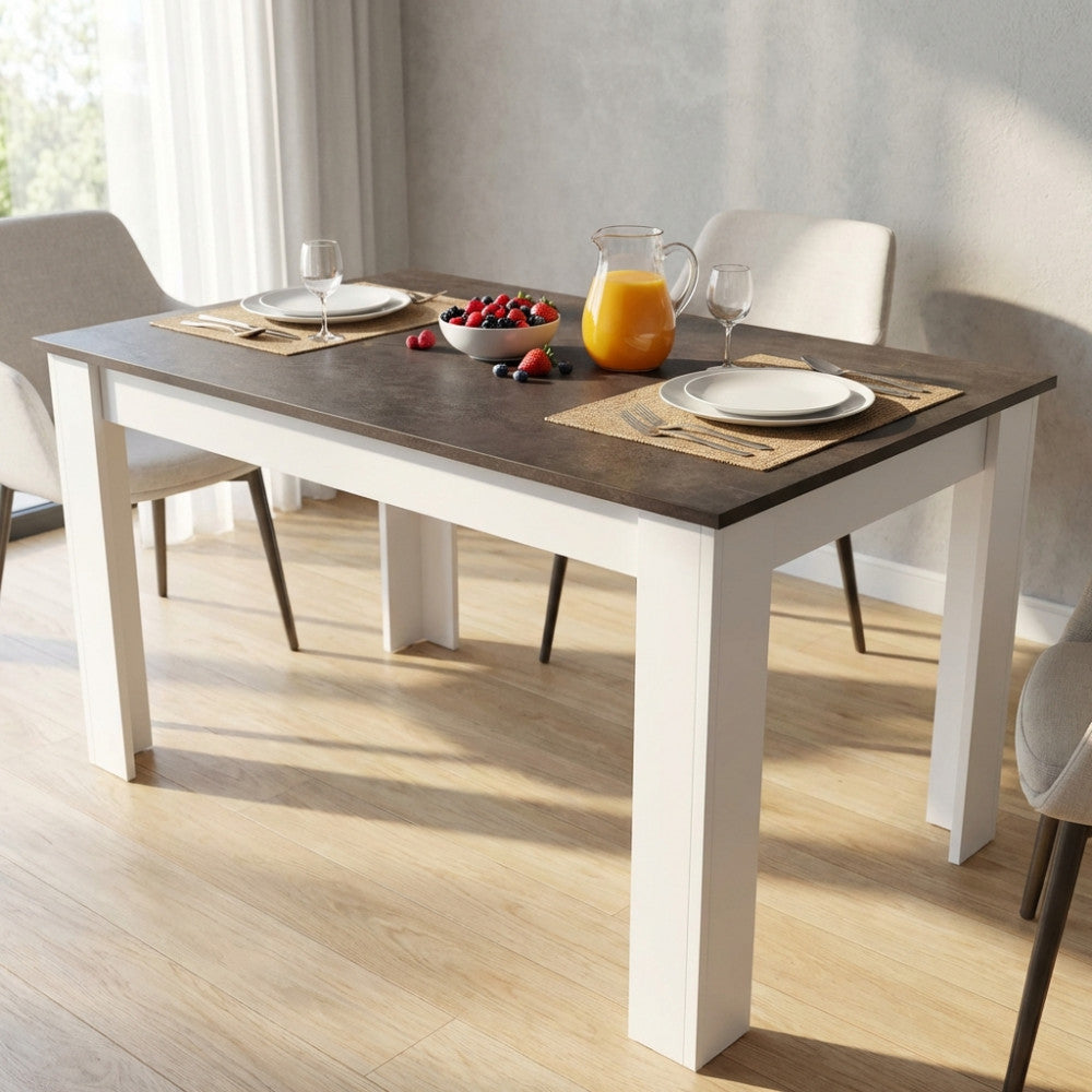 Tavolo da pranzo Pepper in truciolare bilaminato effetto cemento, allestito con colazione in un ambiente luminoso.