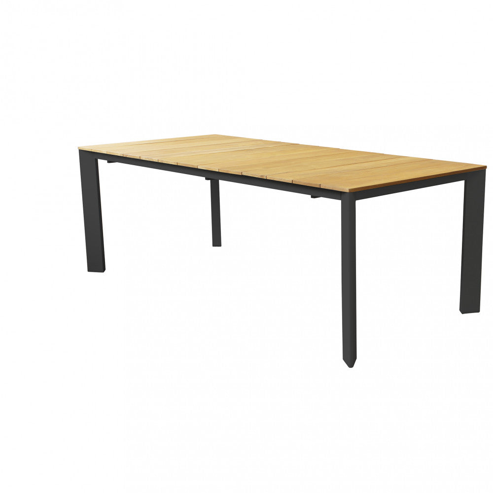 Tavolo da pranzo Tulcán nella sua configurazione chiusa, con piano in teak e gambe antracite.