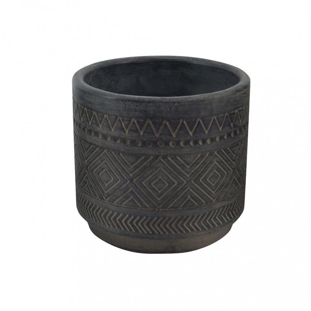 Vista angolare del Vaso Melissa, evidenziando la texture materica e la finitura scura ed elegante.