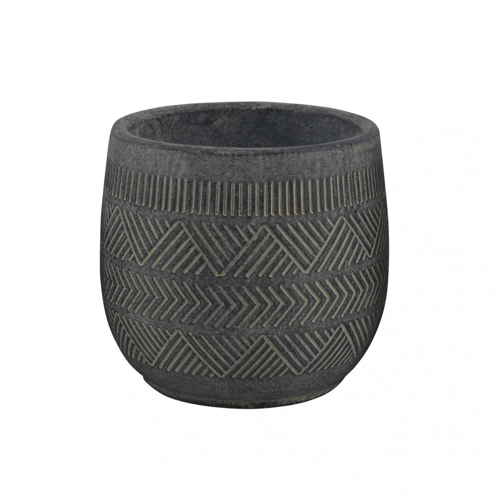Dettaglio in studio del vaso Bucaneve vuoto, che mostra le incisioni geometriche a zig-zag sulla superficie antracite.