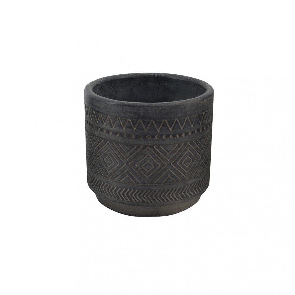 Vista frontale del Vaso Piccolo Melissa vuoto, che evidenzia i dettagli geometrici incisi sulla superficie in fibra sintetica.